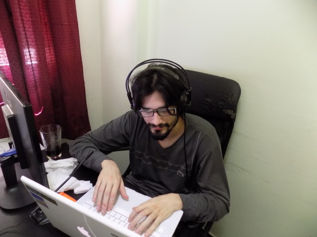 developer listening to music on his headphone