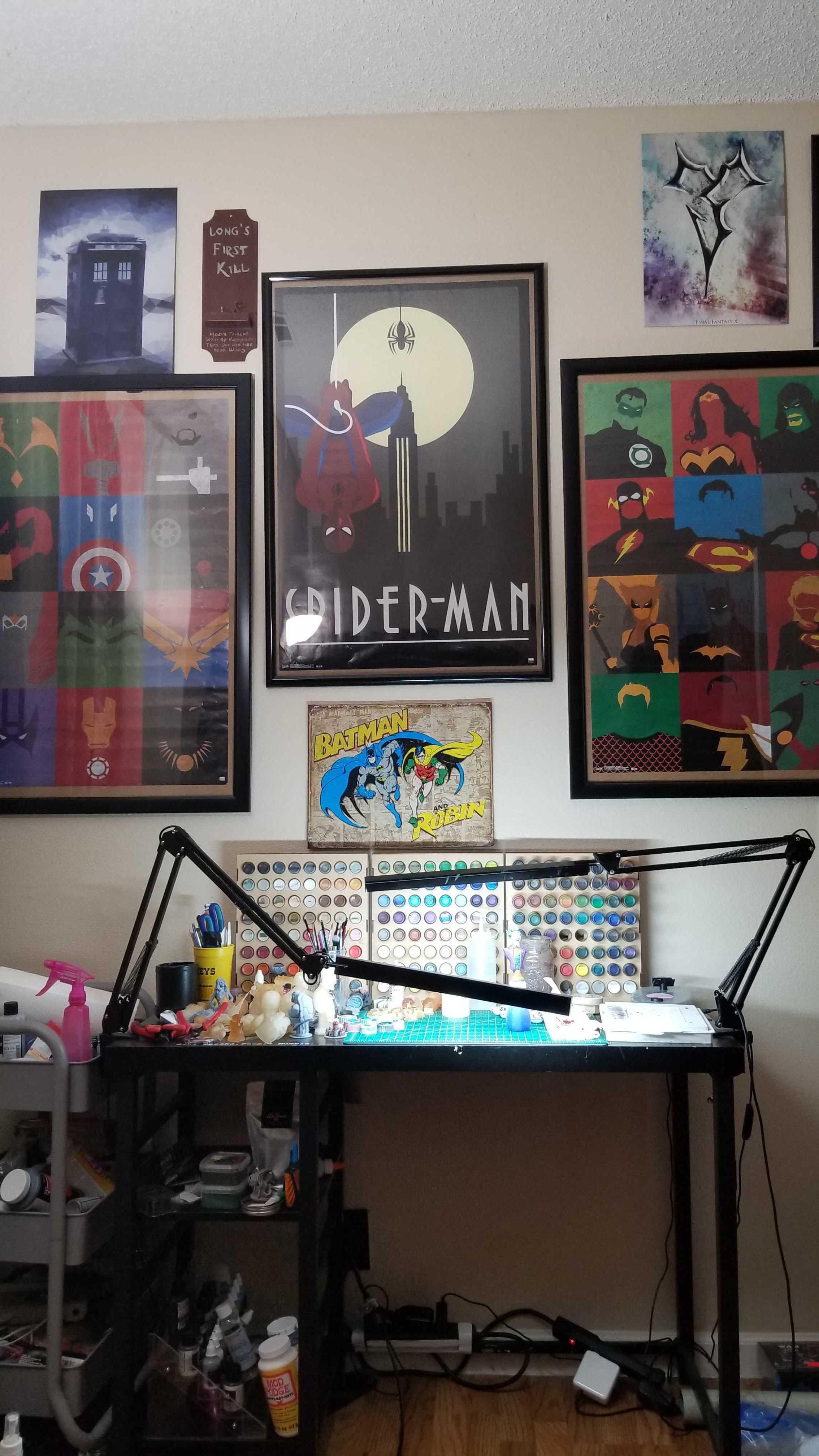 Painting station with color palette and Marvel art galleries above