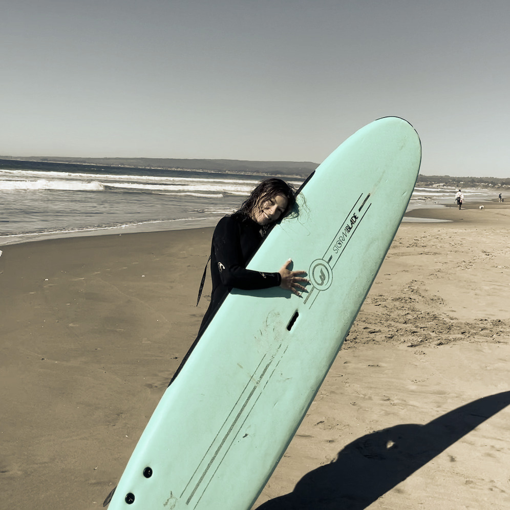 Angelina with surfboard