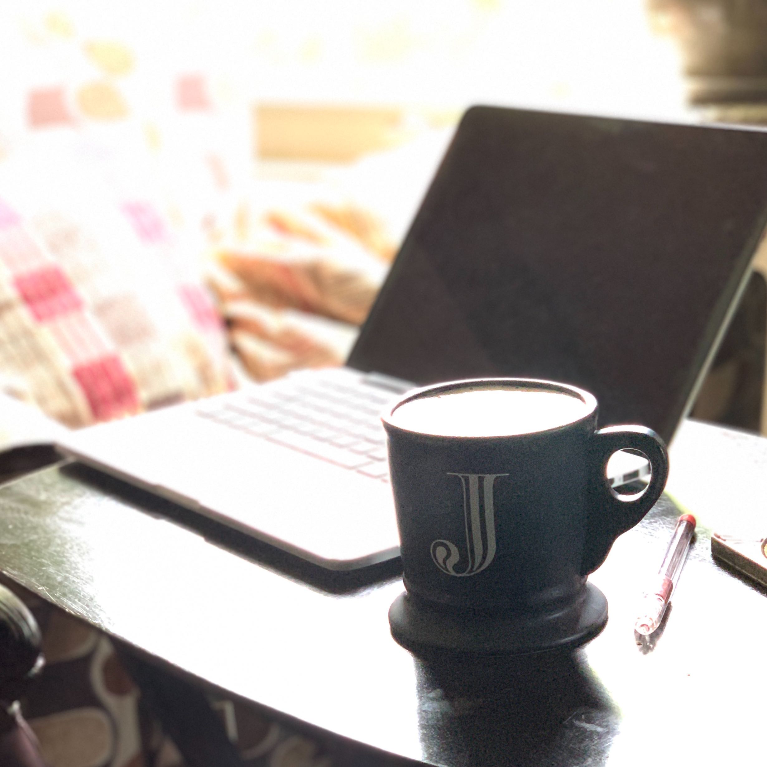 Laptop and a cup of coffee