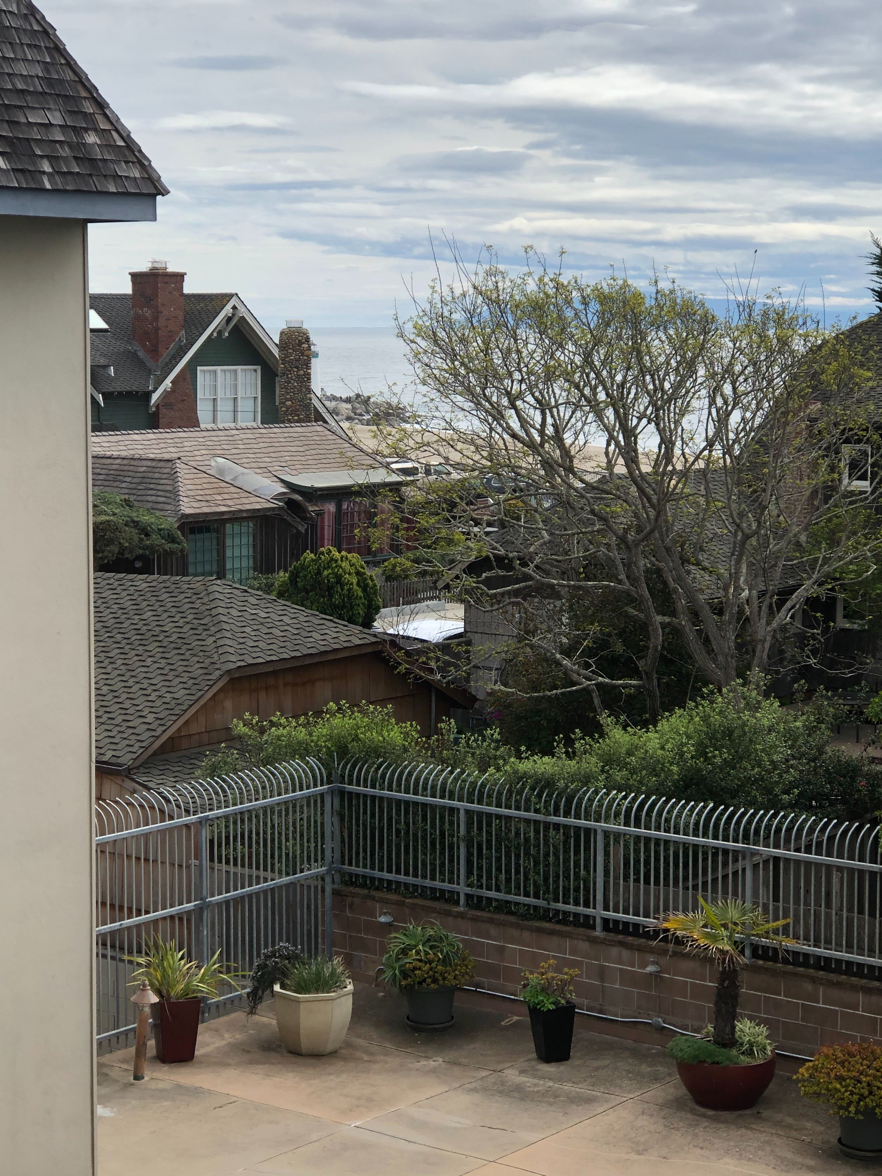 House by the beach with lighthouse