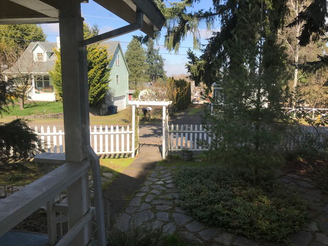 White-gated front yard garden